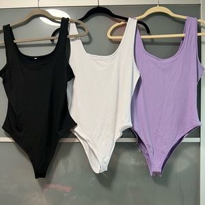 Brand new 3 pack body suit - never worn (qqq amazon)
